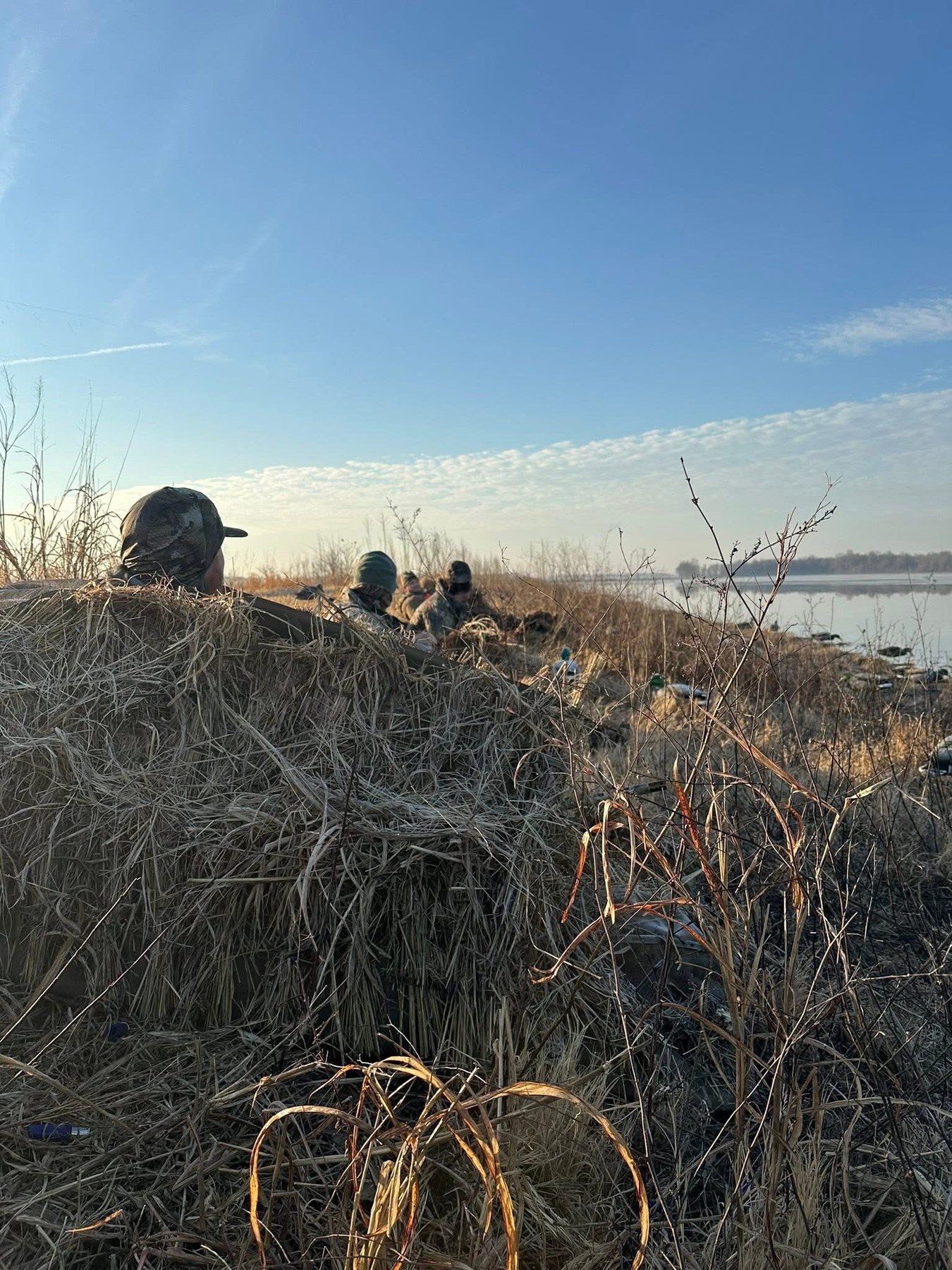 Veterans in a duck blind at sunrise